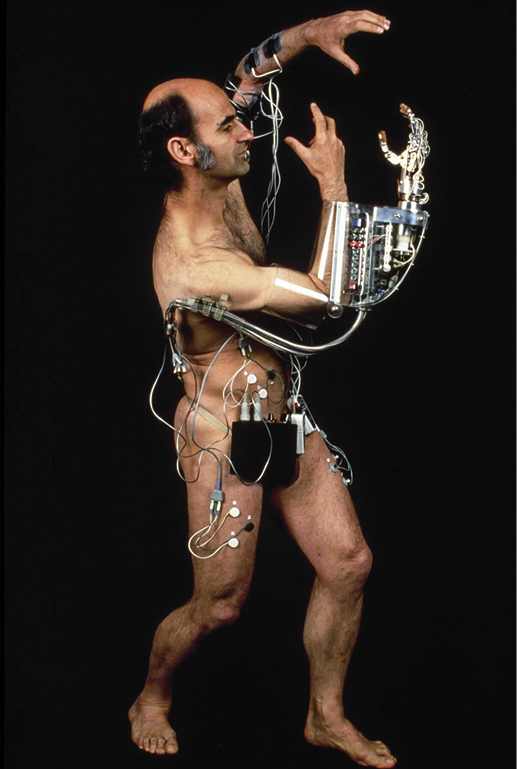 Imagen 1. (Stelarc, 1985). Amplified Body, Laser Eyes & Third Hand, performance.